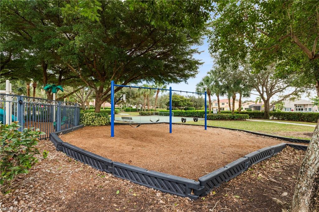 1770 Ribbon Fan Lane Naples, FL 34119 - Photo 31 of 37 a view of outdoor space with trees