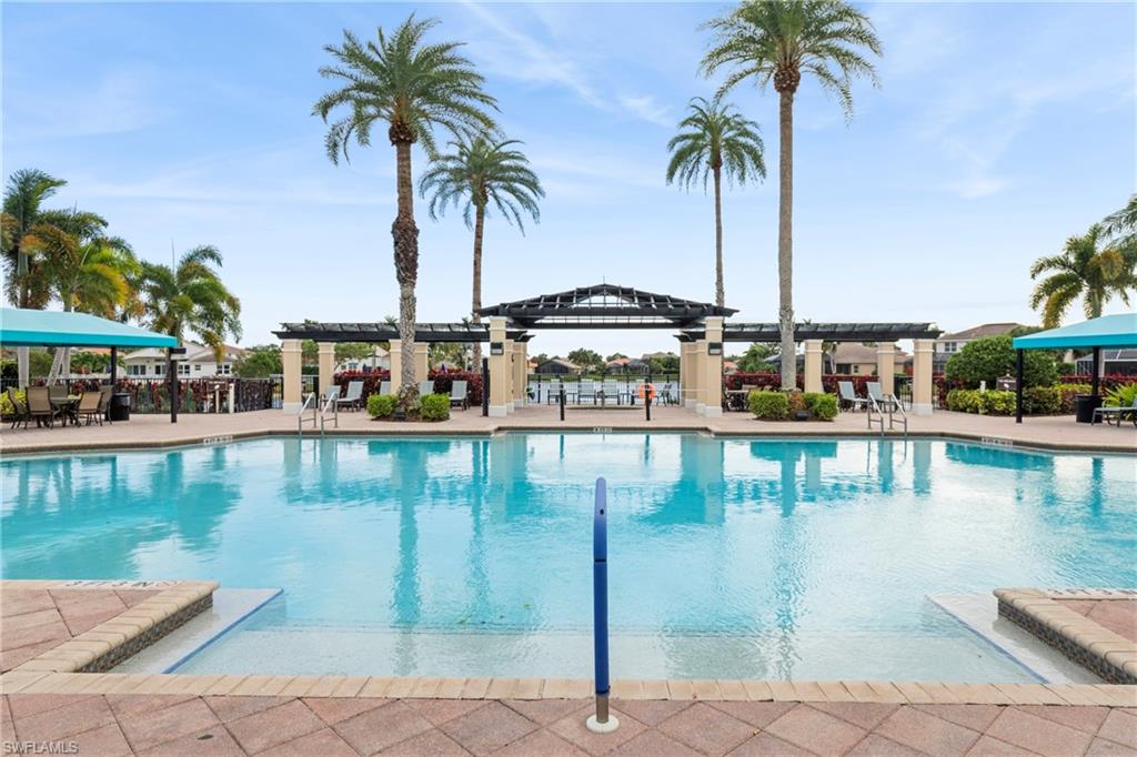 1770 Ribbon Fan Lane Naples, FL 34119 - Photo 37 of 37 a view of swimming pool with outdoor seating