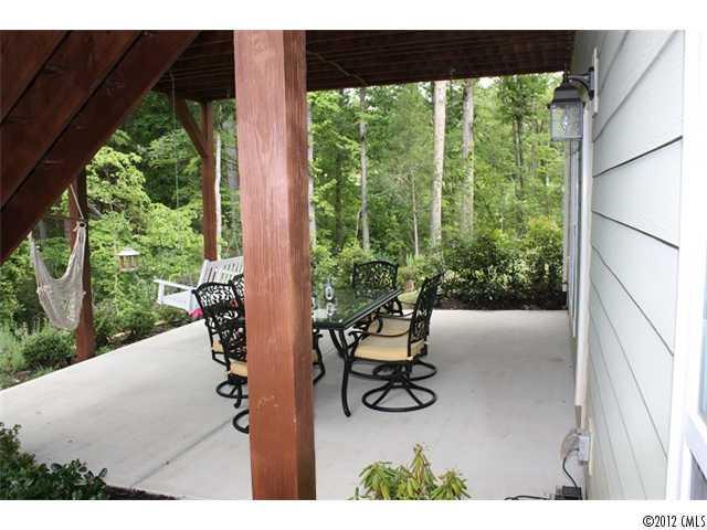 1002 Angelica Lane Tega Cay, SC 29708 - Photo 14 of 16 a view of a porch with chairs and backyard