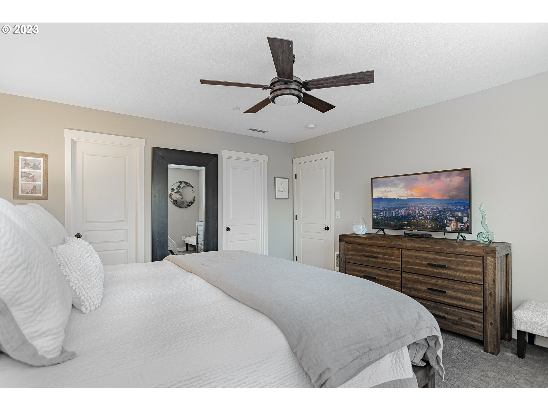 4020 North 1st Way Ridgefield, WA 98642 - Photo 23 of 32 a bedroom with a bed and a flat screen tv
