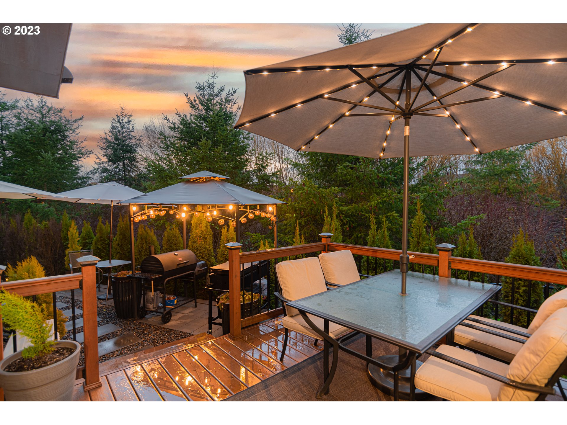 4020 North 1st Way Ridgefield, WA 98642 - Photo 26 of 32 a view of an outdoor sitting area with furniture and umbrella