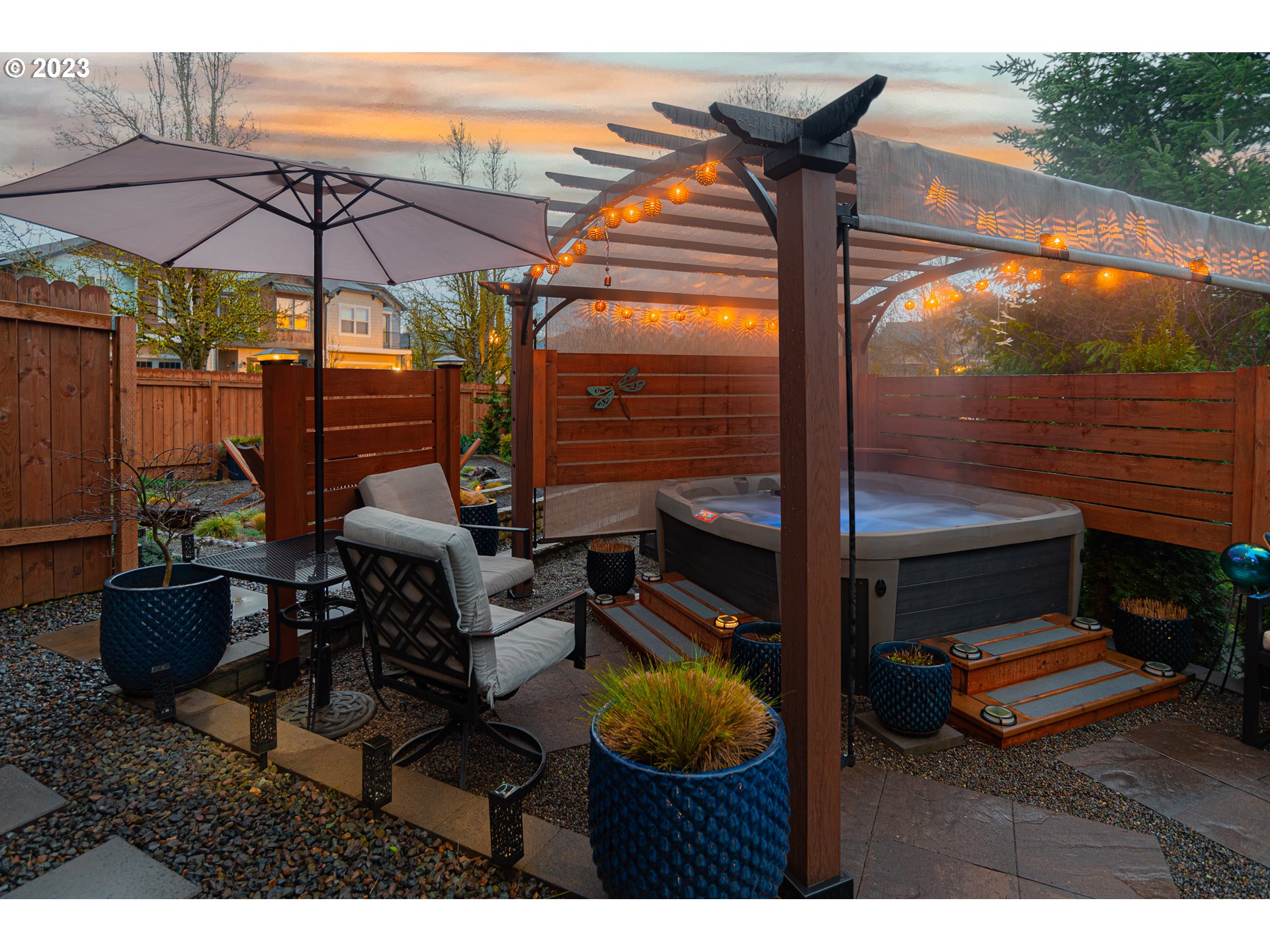 4020 North 1st Way Ridgefield, WA 98642 - Photo 29 of 32 a backyard of a house with barbeque oven table and chairs
