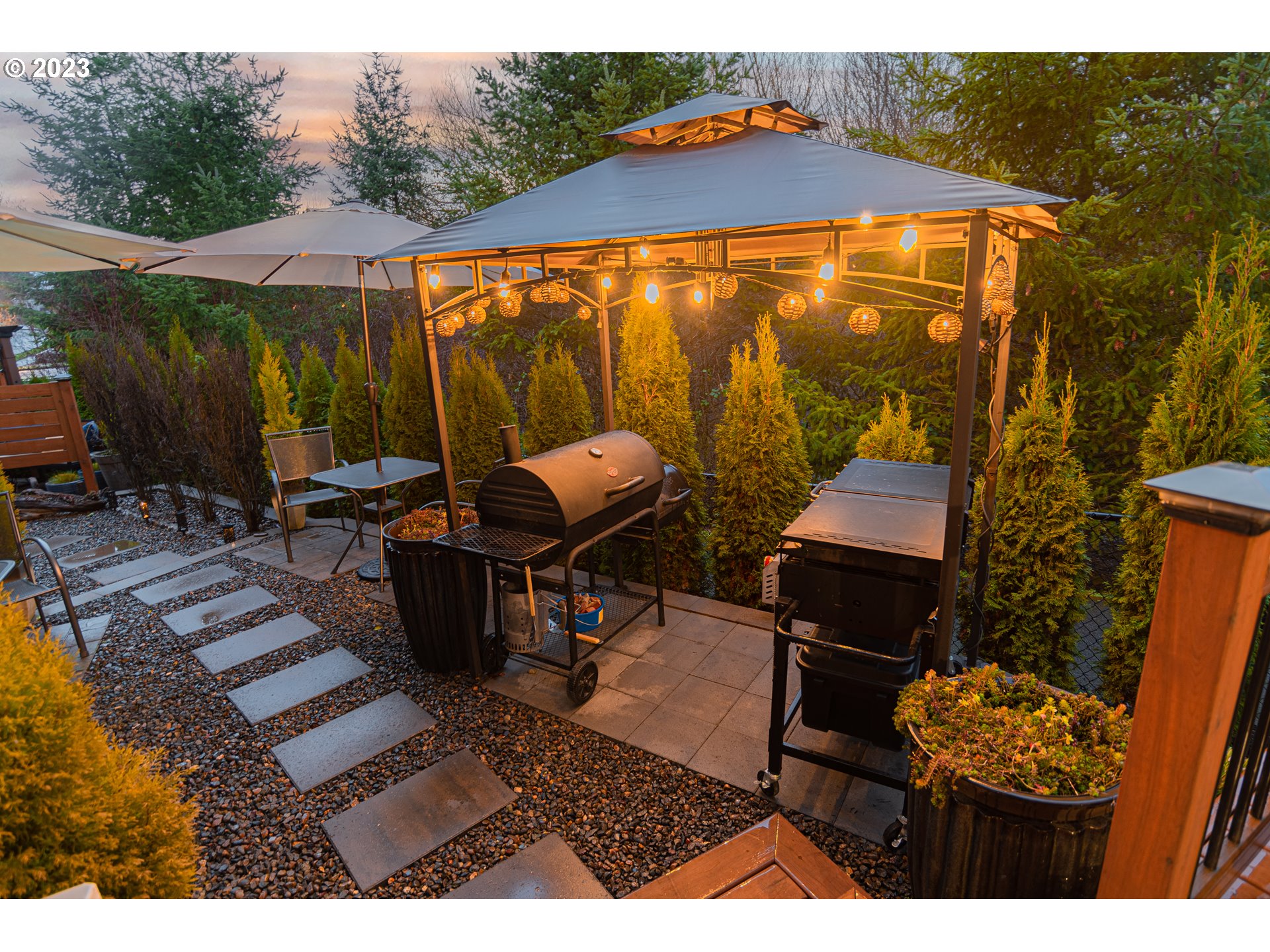 4020 North 1st Way Ridgefield, WA 98642 - Photo 30 of 32 a backyard of a house with table and chairs