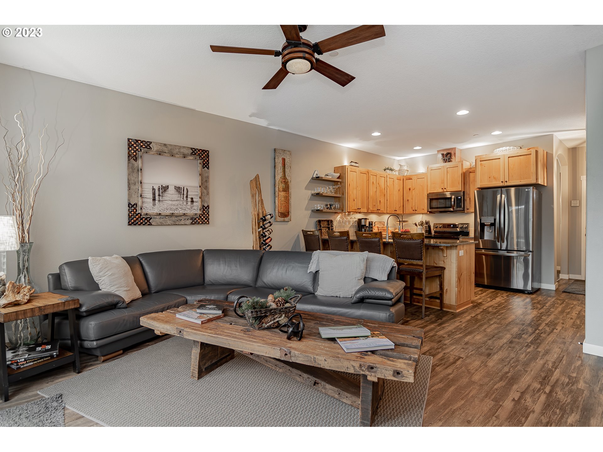 4020 North 1st Way Ridgefield, WA 98642 - Photo 7 of 32 a living room with furniture kitchen view and a chandelier