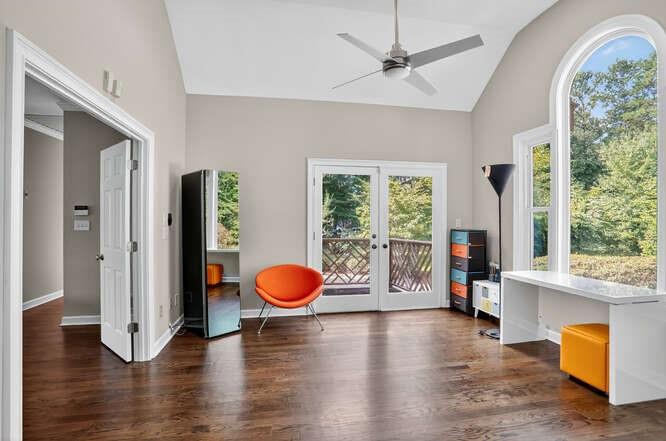 2551 East Maddox Road Buford, GA 30519 - Photo 12 of 50 a view of a livingroom with wooden floor and a large window