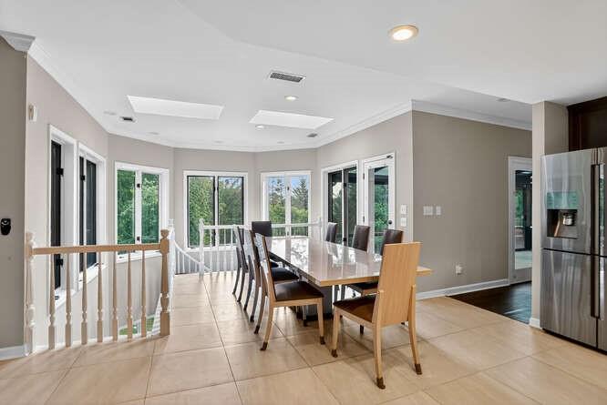 2551 East Maddox Road Buford, GA 30519 - Photo 19 of 50 a view of a dining room with furniture large window and outside view