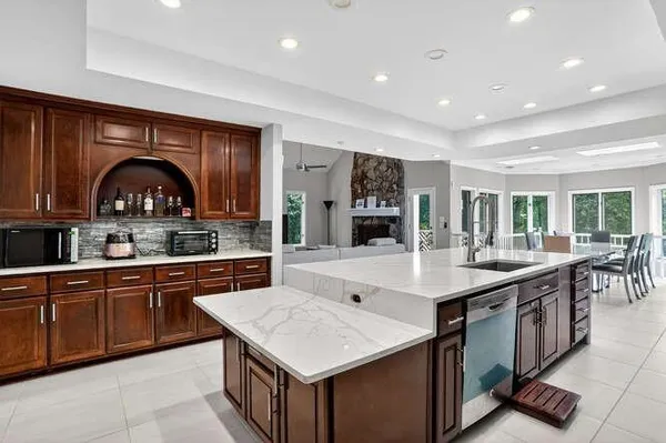 a kitchen with stainless steel appliances granite countertop a stove and a sink