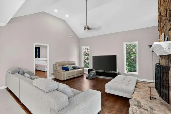 a living room with furniture and a flat screen tv
