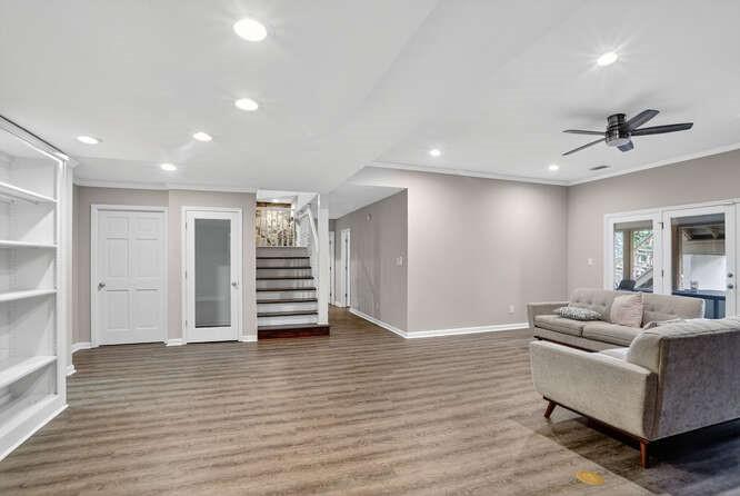 2551 East Maddox Road Buford, GA 30519 - Photo 31 of 50 a living room with furniture and wooden floor