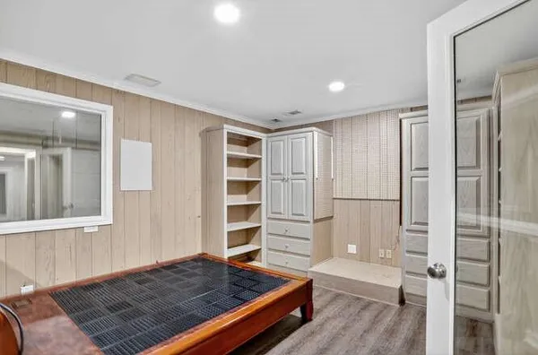 a view of wooden floor and windows in a room