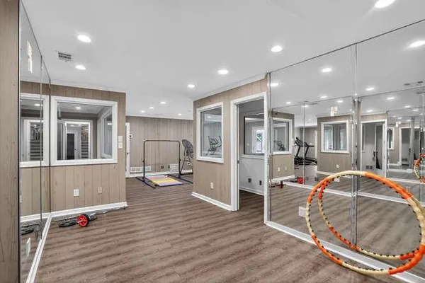 a very nice looking room with a large window and furniture