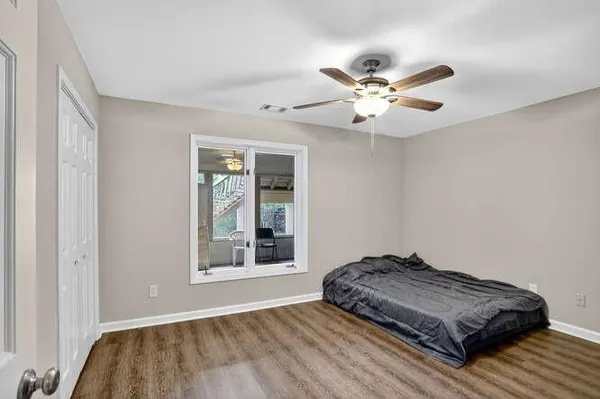 a bedroom with bed and window