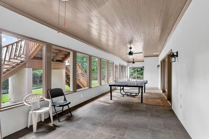 2551 East Maddox Road Buford, GA 30519 - Photo 43 of 50 a living room with furniture a flat screen tv and a large window