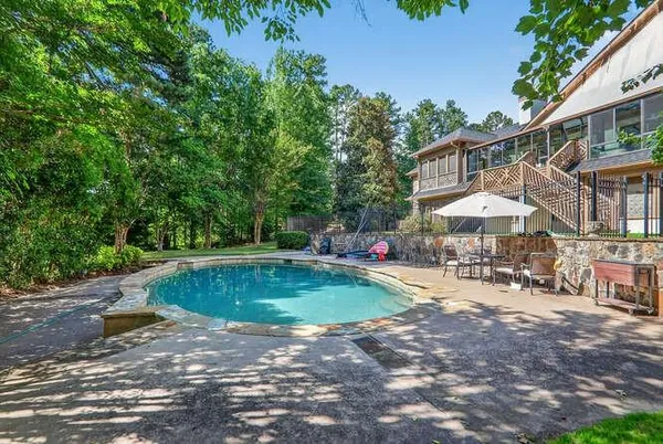 a view of a patio with chairs and plants
