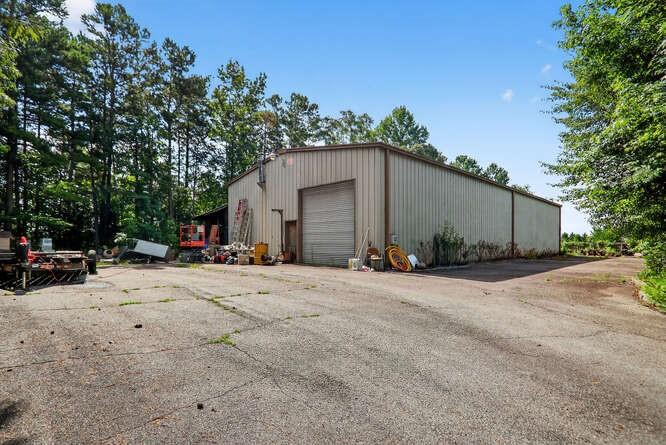 2551 East Maddox Road Buford, GA 30519 - Photo 50 of 50 a view of a house with a yard and garage