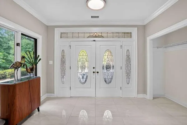 a view of entryway with wooden floor
