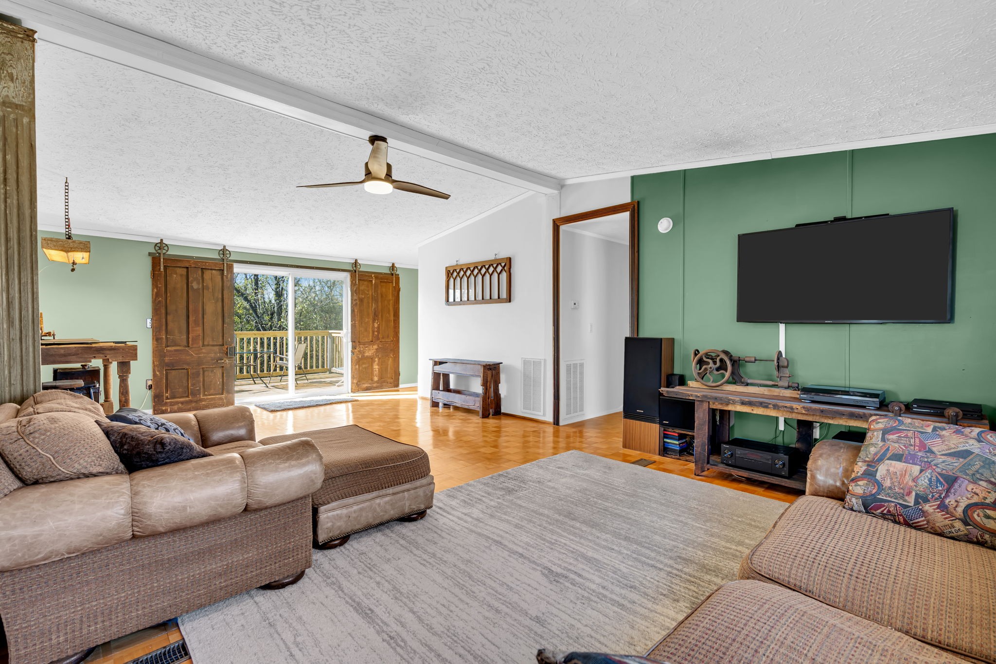 1039 Riverview Road Mount Juliet, TN 37122 - Photo 11 of 40 a living room with furniture and a flat screen tv