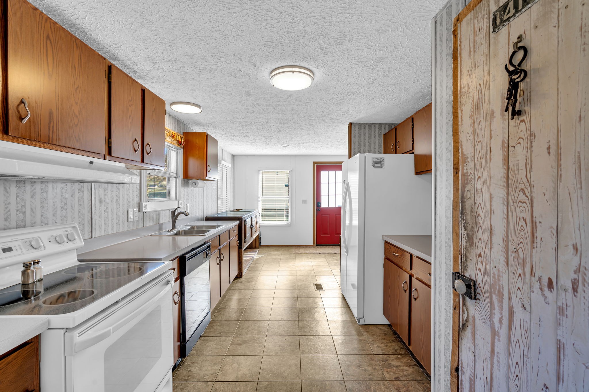 1039 Riverview Road Mount Juliet, TN 37122 - Photo 14 of 40 a kitchen with a sink and a stove top oven