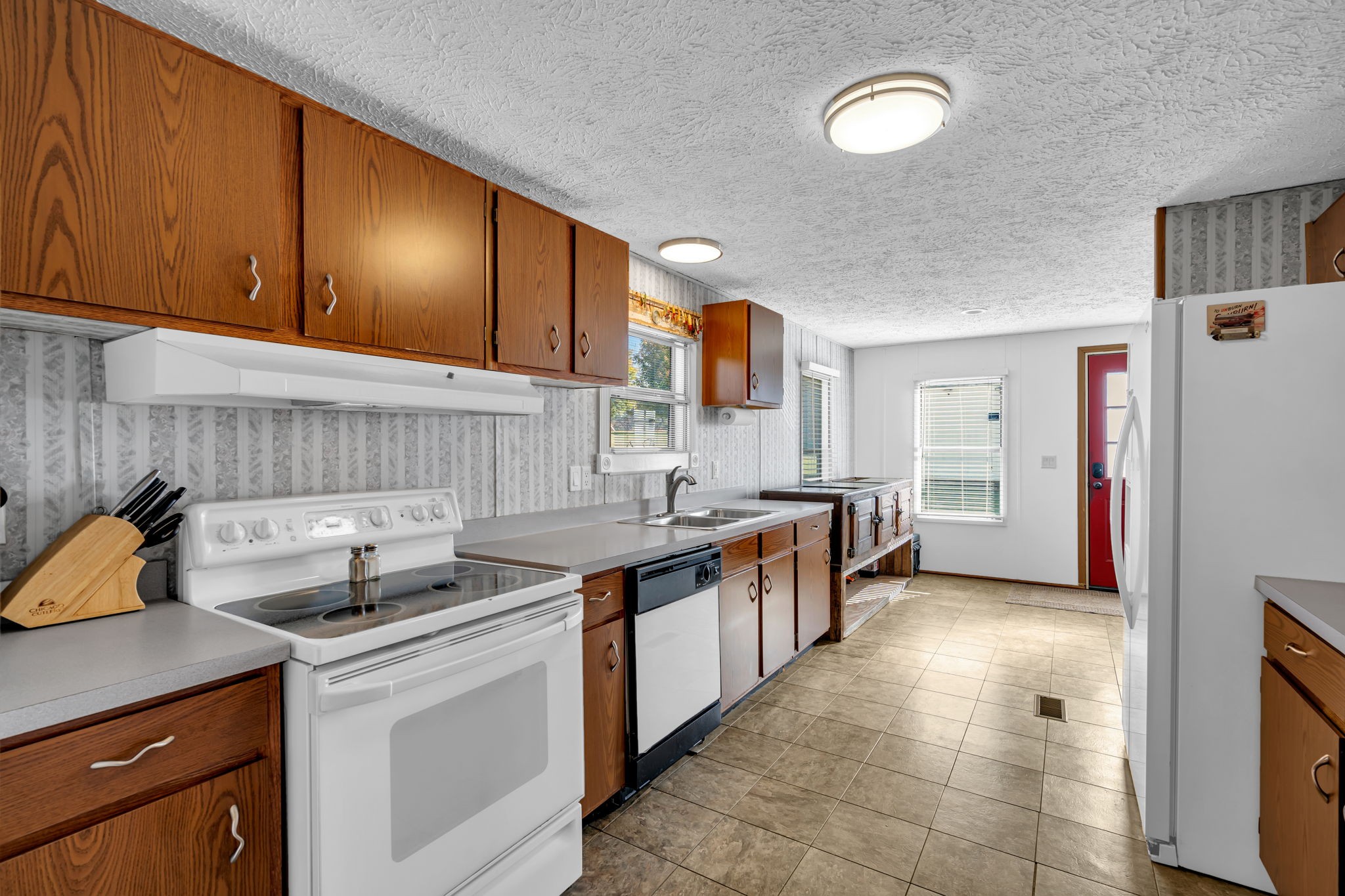1039 Riverview Road Mount Juliet, TN 37122 - Photo 17 of 40 a kitchen with stainless steel appliances a sink stove and cabinets