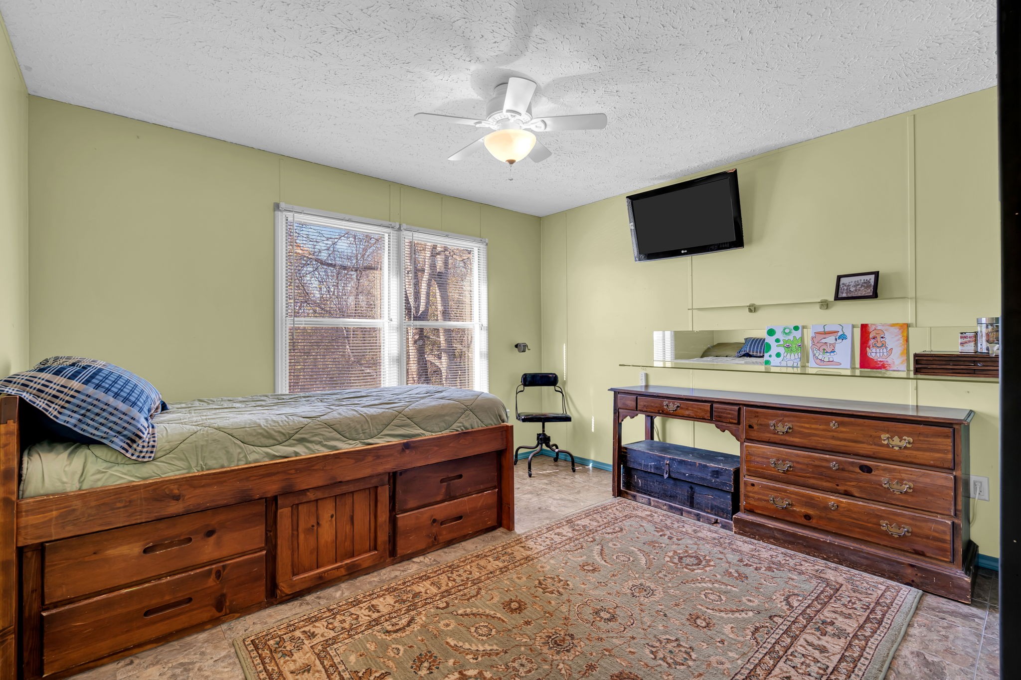 1039 Riverview Road Mount Juliet, TN 37122 - Photo 25 of 40 a bedroom with a bed and flat screen tv