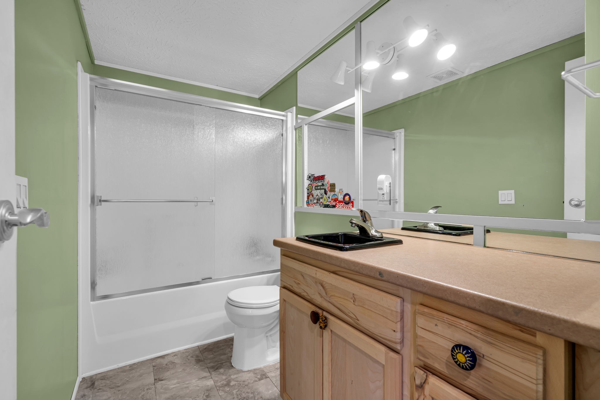 1039 Riverview Road Mount Juliet, TN 37122 - Photo 27 of 40 a bathroom with a sink toilet vanity and shower