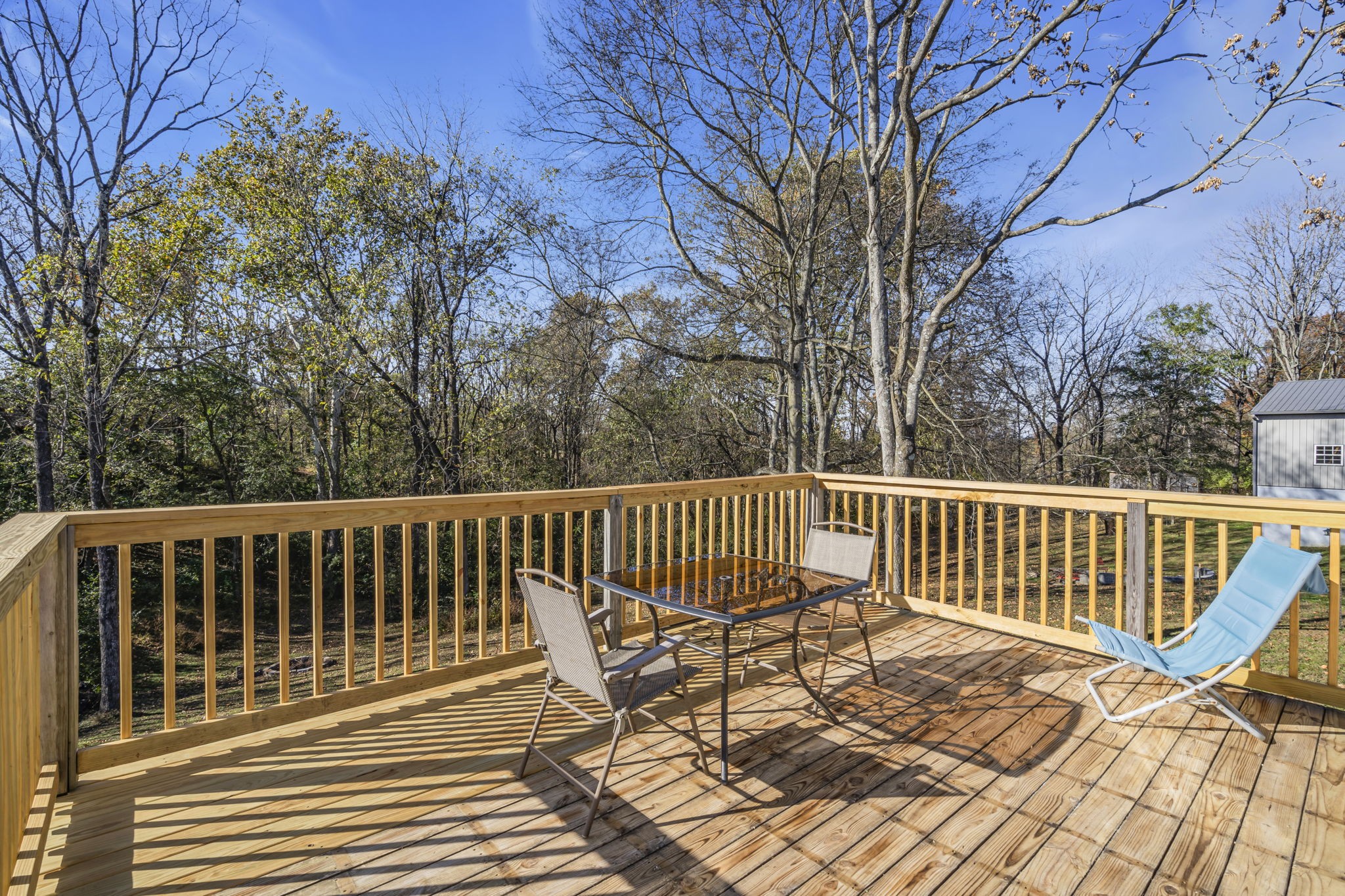 1039 Riverview Road Mount Juliet, TN 37122 - Photo 28 of 40 a view of a chair and table on the deck