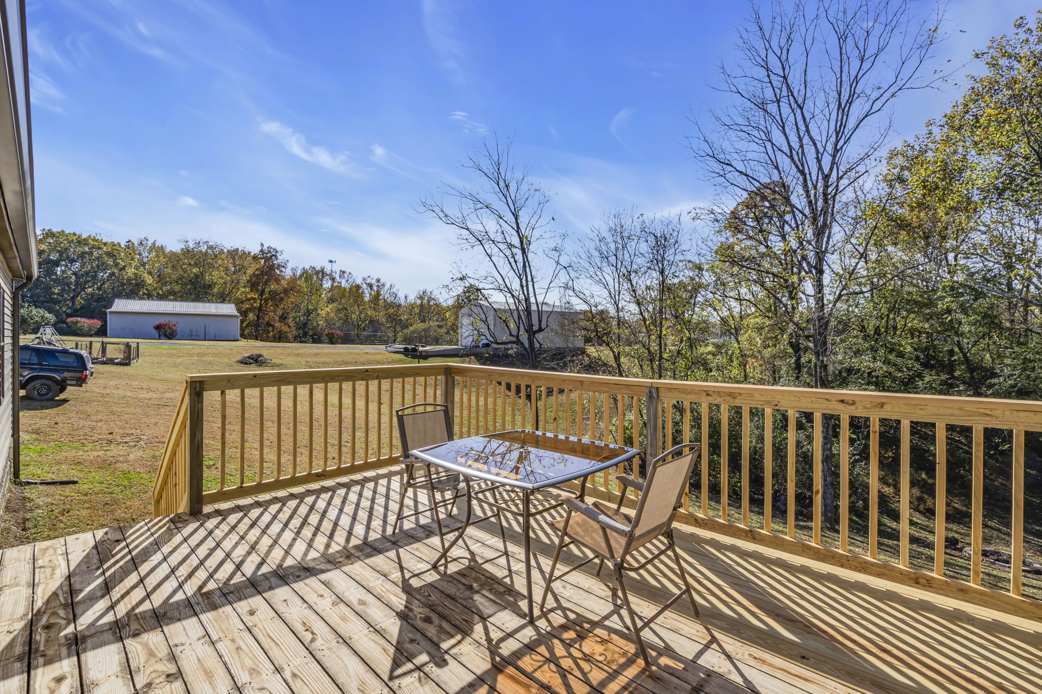 1039 Riverview Road Mount Juliet, TN 37122 - Photo 29 of 40 a view of a balcony with wooden floor and fence