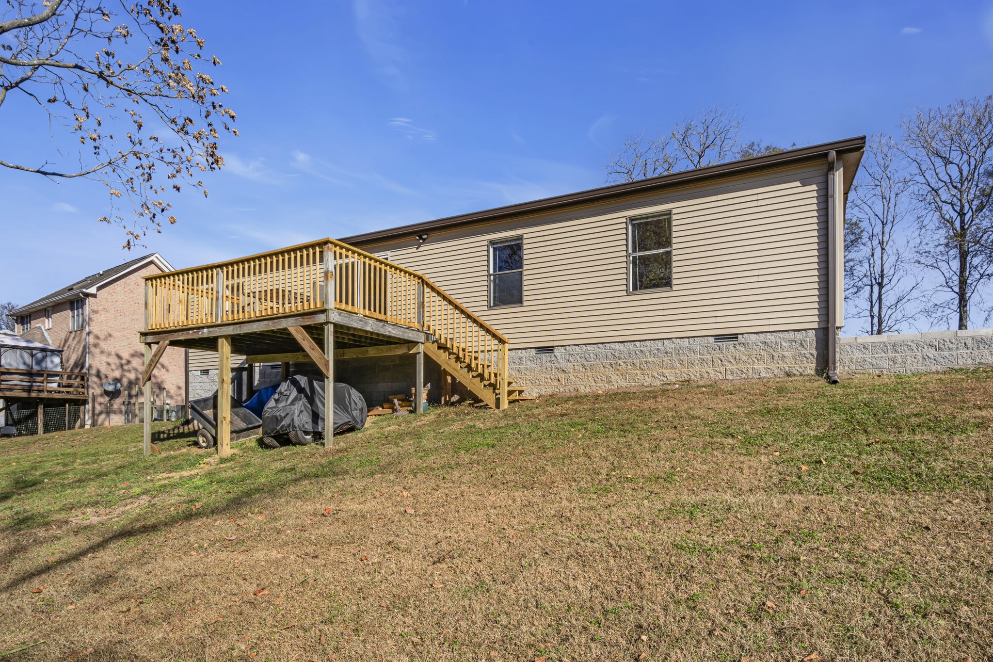1039 Riverview Road Mount Juliet, TN 37122 - Photo 31 of 40 a view of a wooden house with a yard