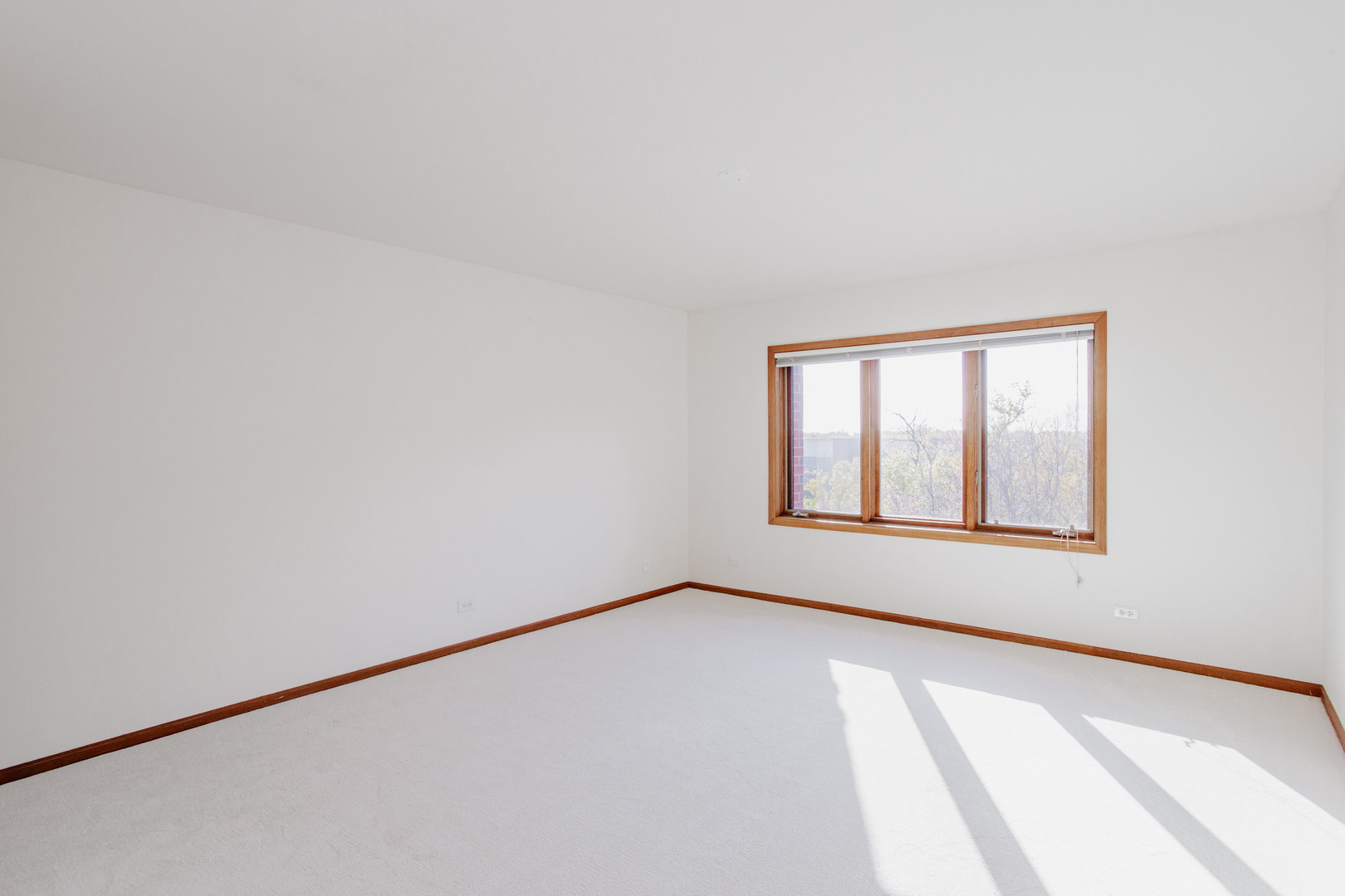 1685 Mill Street, Unit 605 Des Plaines, IL 60016 - Photo 15 of 25 a view of an empty room with a window