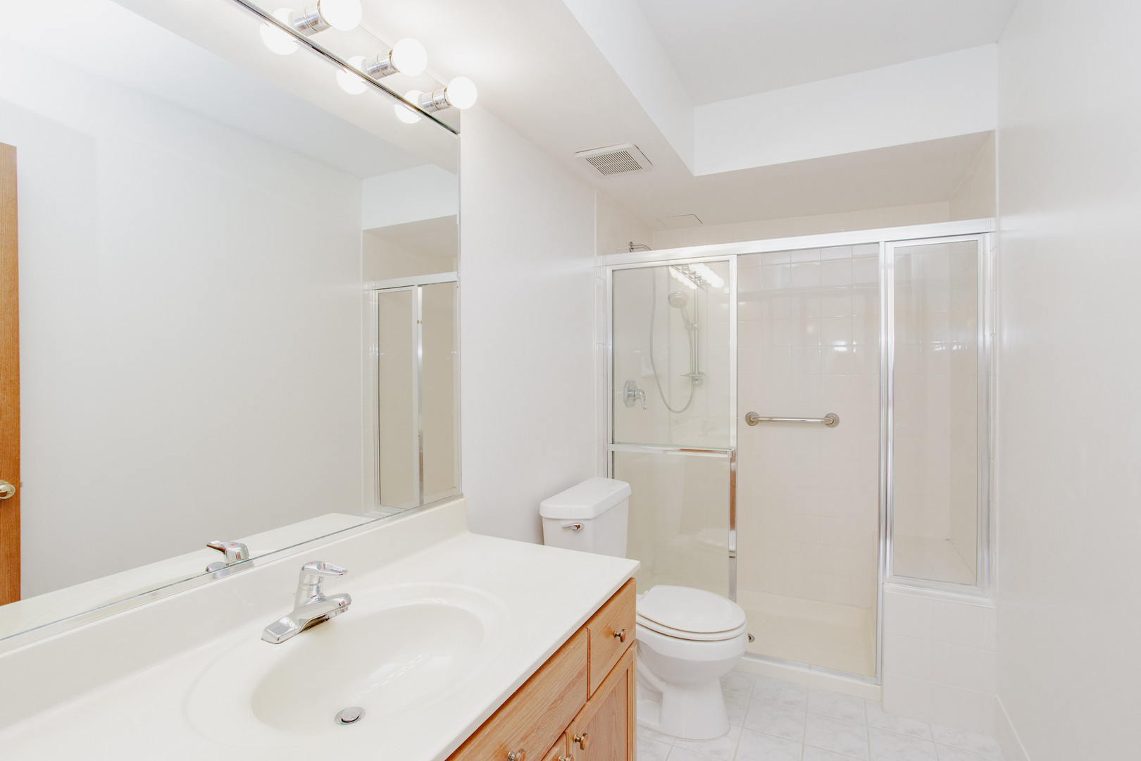 1685 Mill Street, Unit 605 Des Plaines, IL 60016 - Photo 19 of 25 a bathroom with a sink a toilet and shower