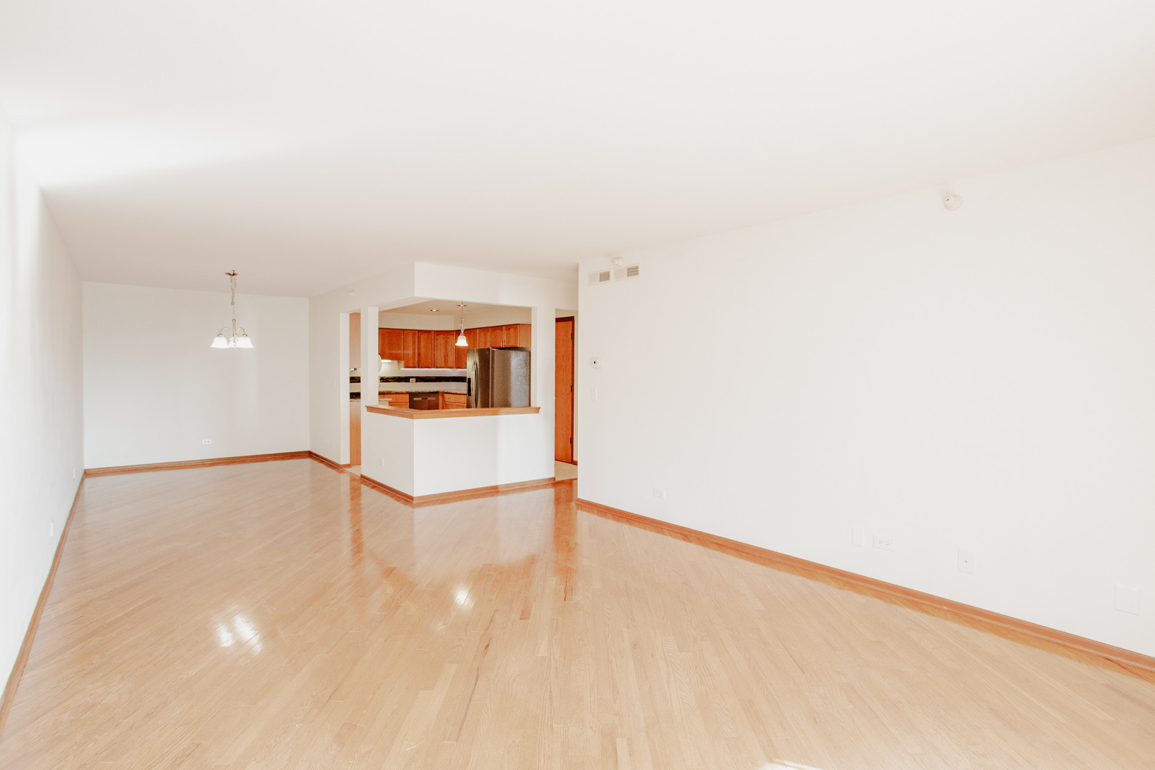 1685 Mill Street, Unit 605 Des Plaines, IL 60016 - Photo 10 of 25 a view of a room with a wooden floor
