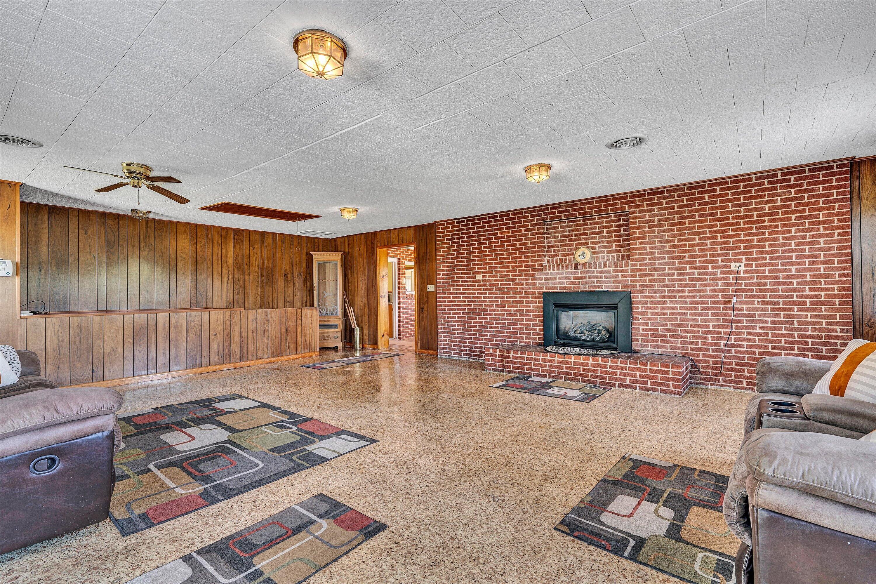 3673 Mt Zion Road Blacksburg, VA 24060 - Photo 36 of 51 a living room with furniture and a fireplace