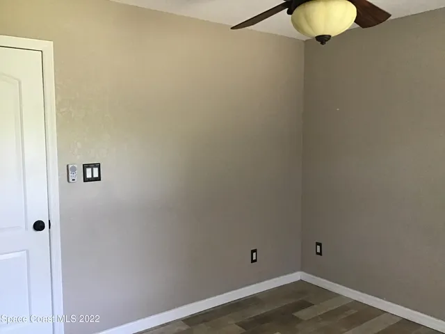 a view of a small space with wooden floor