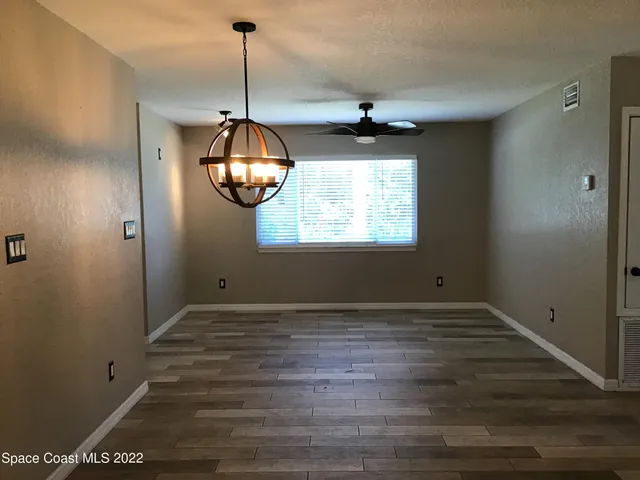 a view of an entryway with chandelier