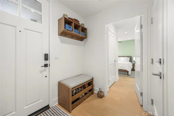 a view of a room with wooden floor