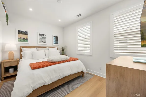 a bedroom with bed and a window