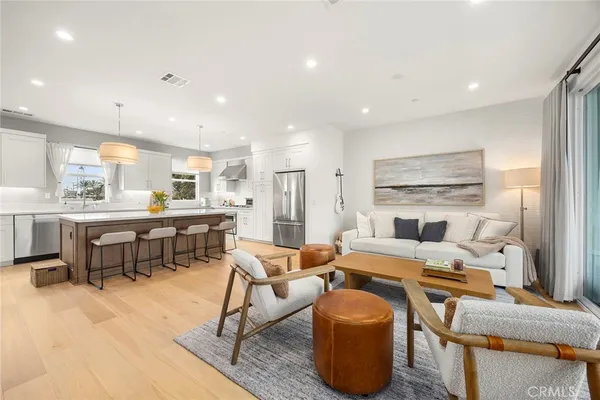 a large kitchen with a table and chairs