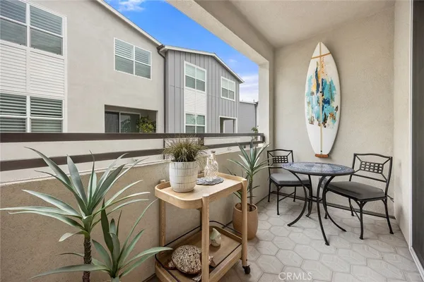 a view of a dining room with furniture and a potted plant