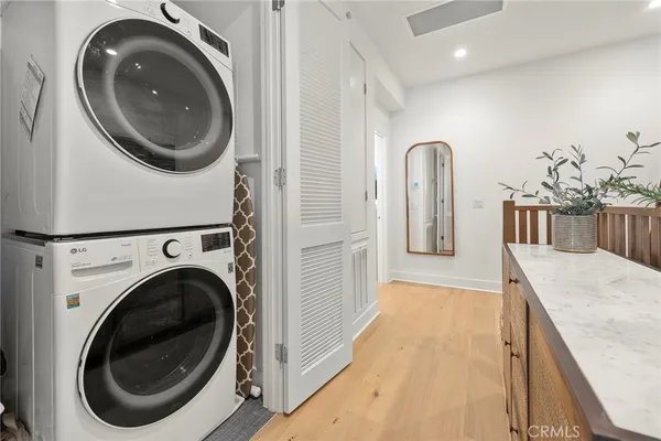 a view of a hallway with washer and dryer