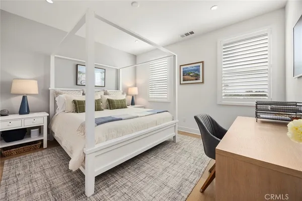 a bedroom with a bed and a table in it