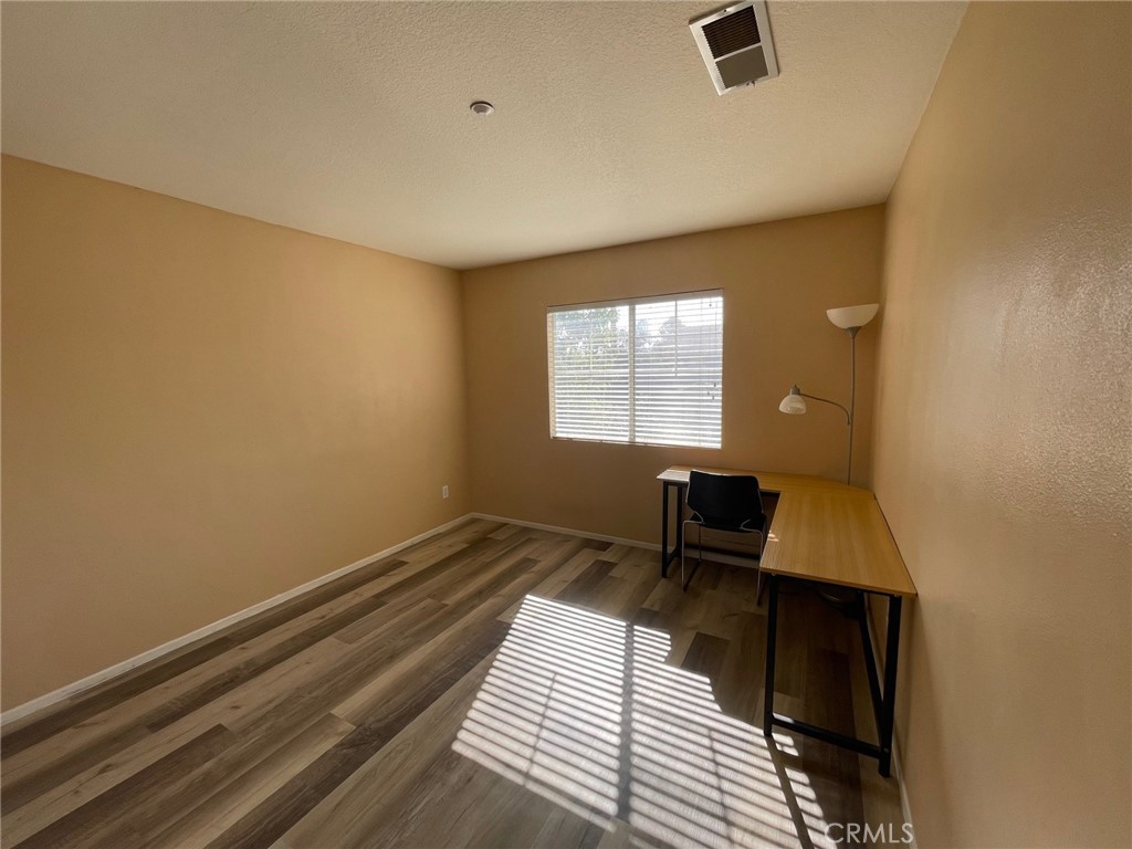 1434 Haddington Drive Riverside, CA 92507 - Photo 32 of 40 a view of workspace with wooden floor and window