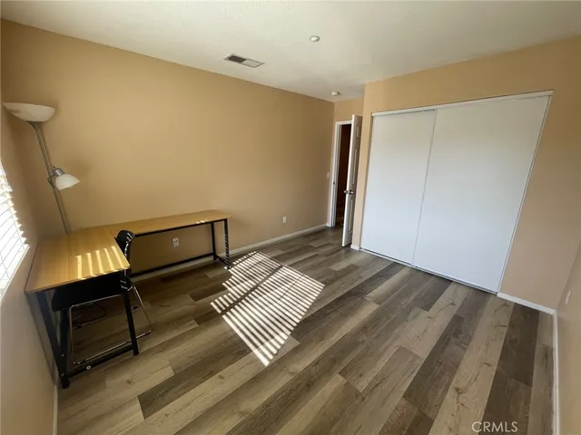 a room with a bed and a window