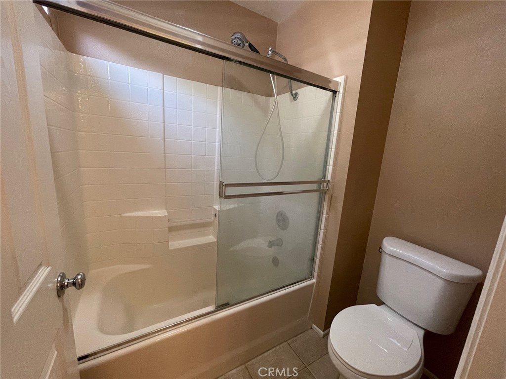 1434 Haddington Drive Riverside, CA 92507 - Photo 38 of 40 a white toilet sitting next to a bath tub