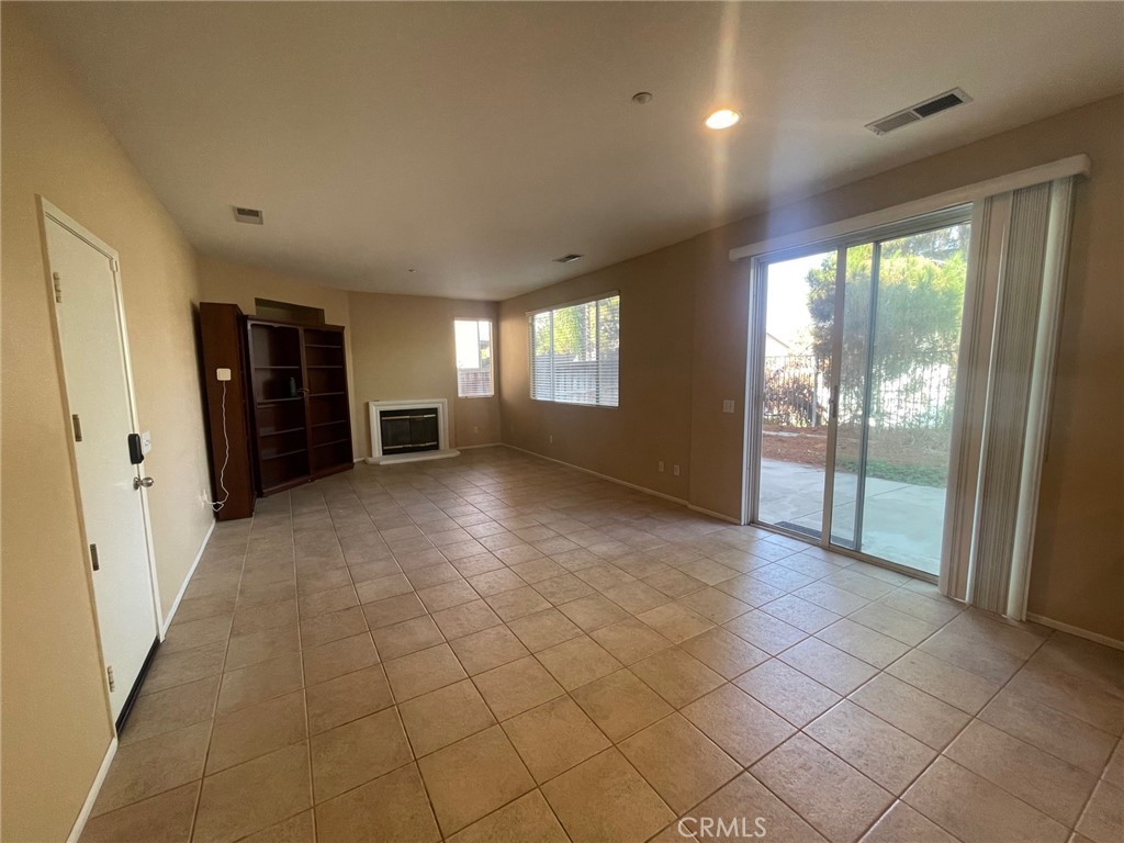 1434 Haddington Drive Riverside, CA 92507 - Photo 10 of 40 a view of a big room with windows and chandelier