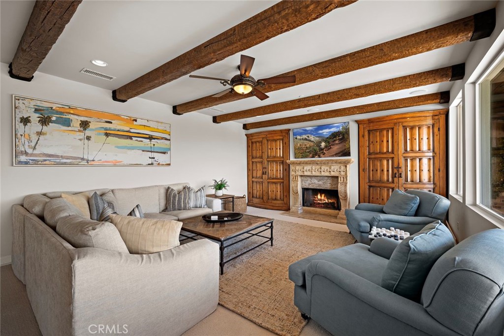 5 Via Monarca Street Dana Point, CA 92629 - Photo 6 of 64 a living room with furniture and a fireplace