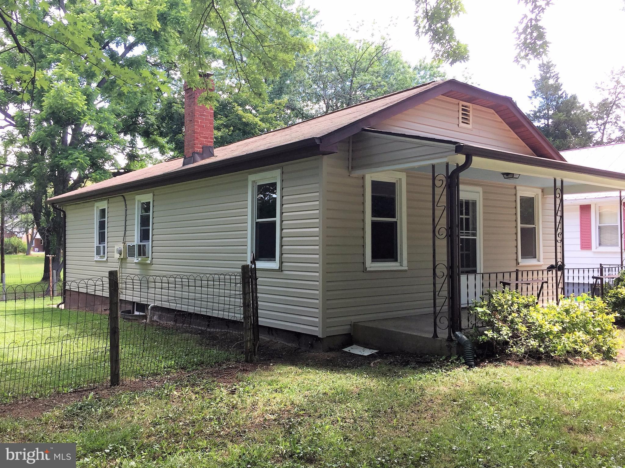 1675 Shookstown Road Frederick, MD 21702 - Photo 2 of 19 a front view of a house with a yard