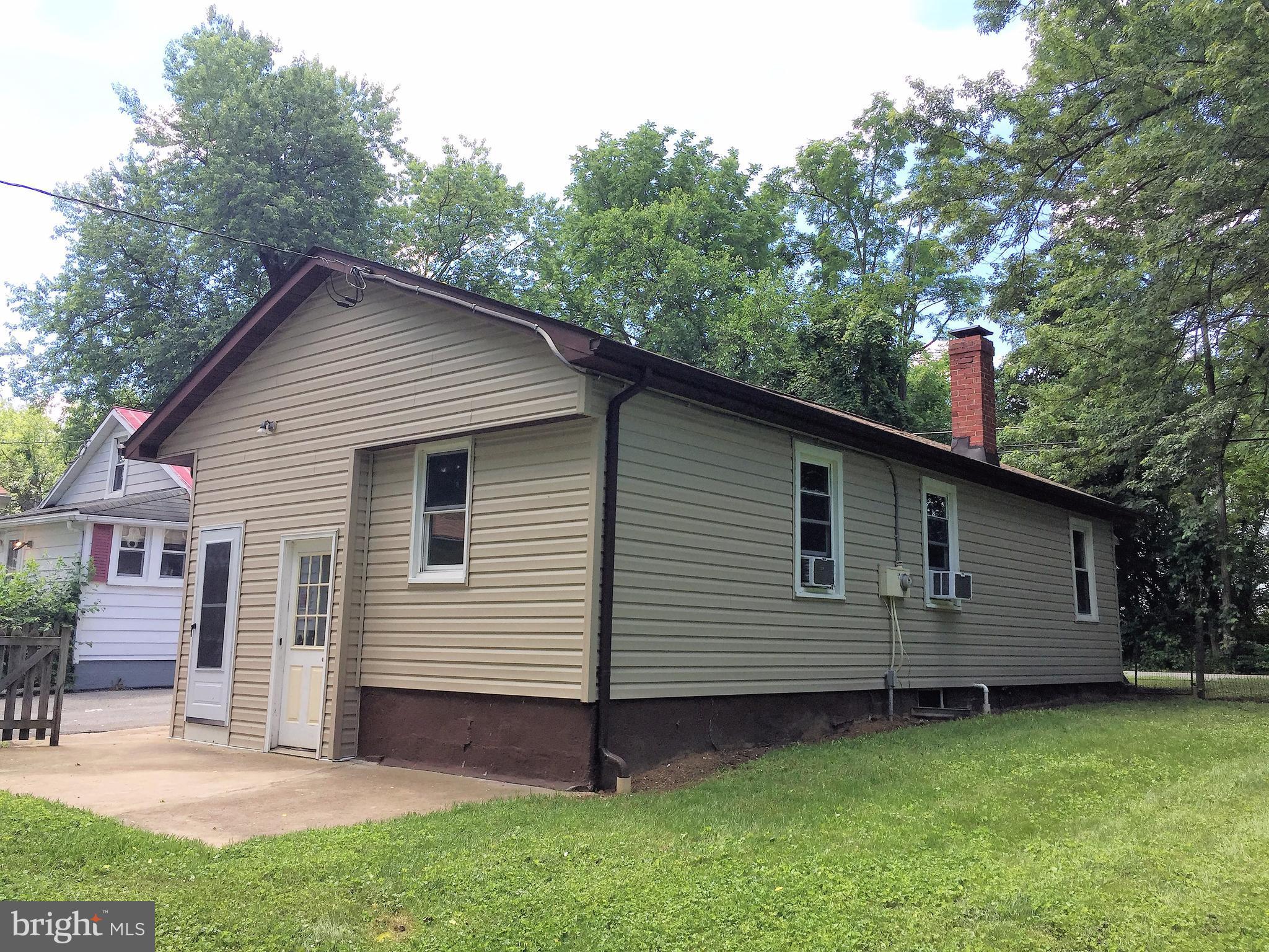 1675 Shookstown Road Frederick, MD 21702 - Photo 19 of 19 a view of a small house with a yard