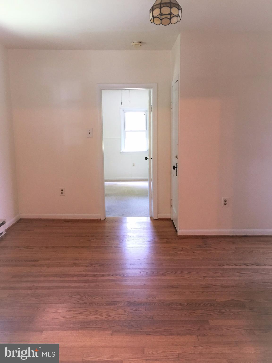 1675 Shookstown Road Frederick, MD 21702 - Photo 5 of 19 a view of a room with wooden floor and a window