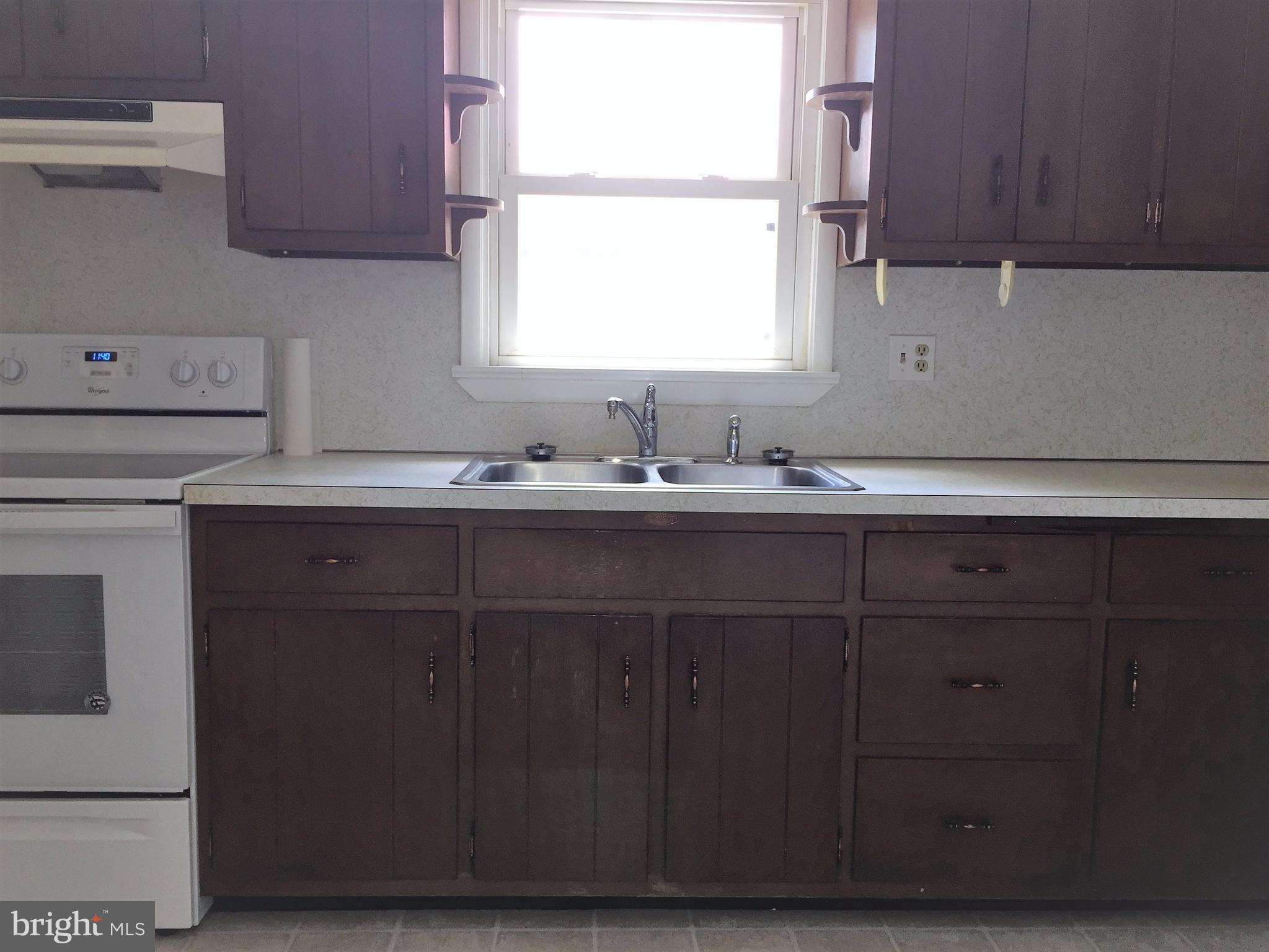 1675 Shookstown Road Frederick, MD 21702 - Photo 8 of 19 a kitchen with a sink cabinets and a window