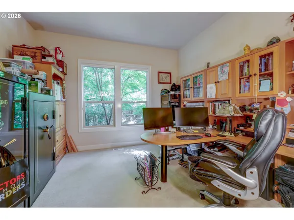 a workspace with furniture and a window